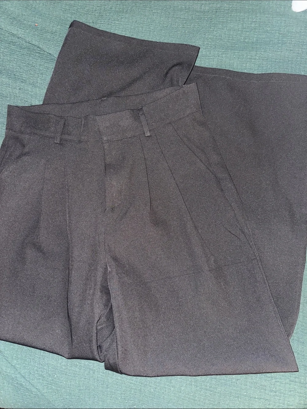 High-waisted black pleated trouser